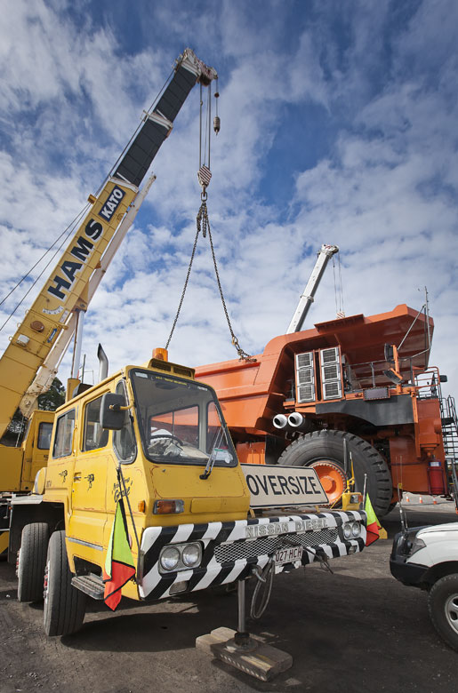 mining photography crane lifting body onto haul truck large